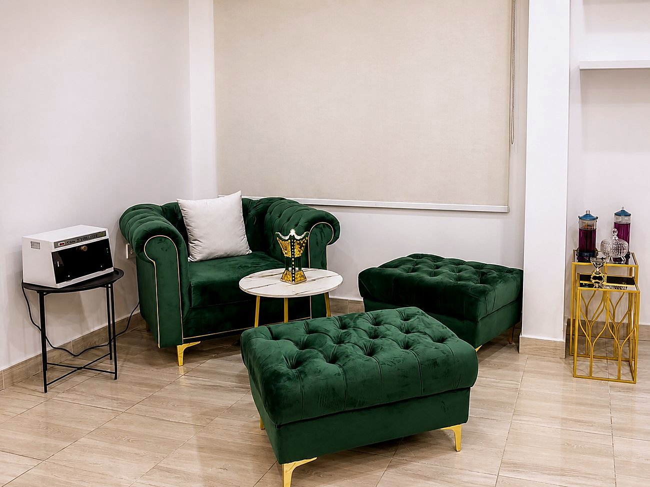 Green velvet seating with gold accents — salon interior photography
